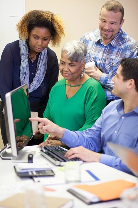 Neal's Accounting & Tax Service Group of multi ethnic business people brainstorming